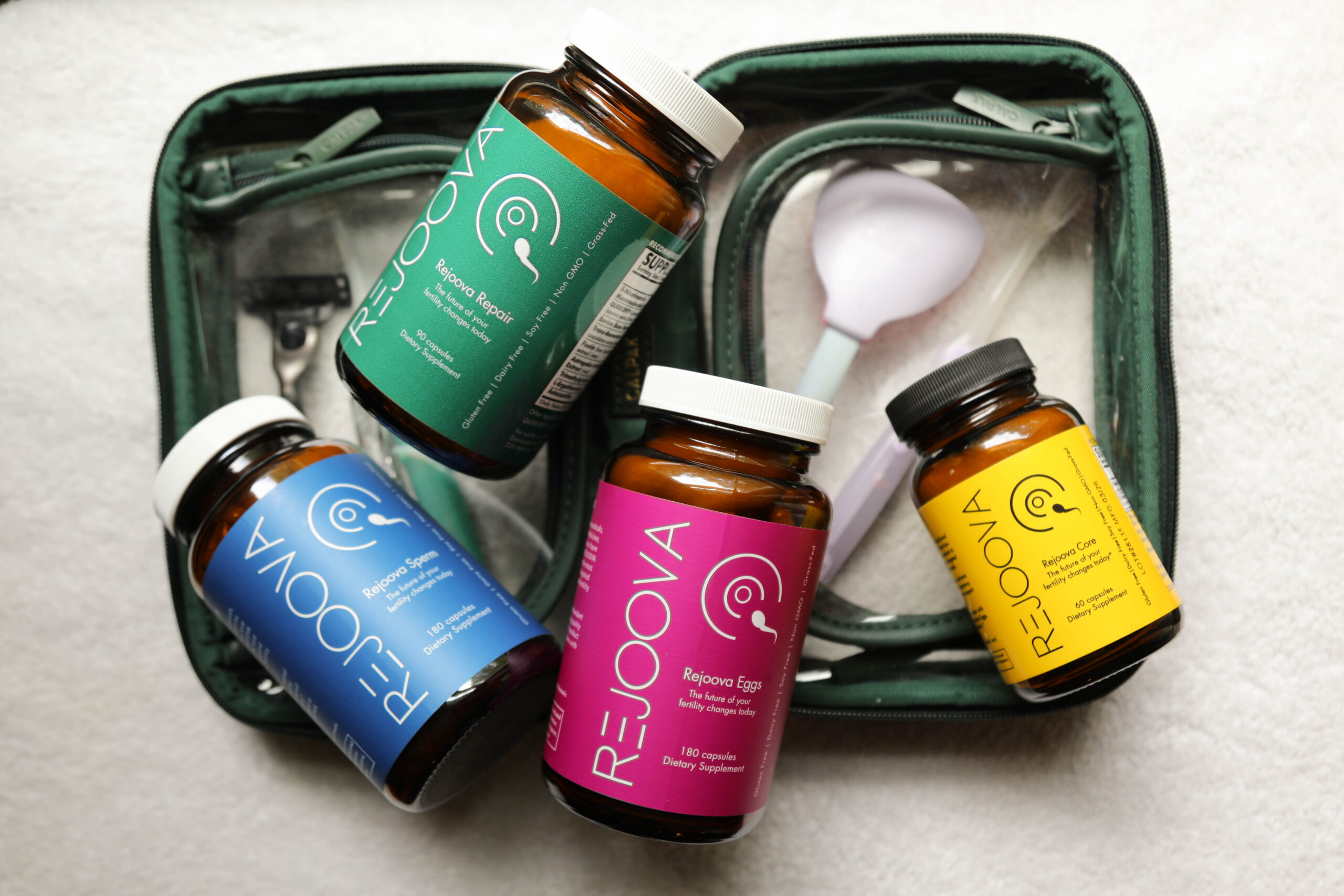 Rejoova Sperm, Rejoova Repair, Rejoova Eggs, and Rejoova Core with a travel bag
